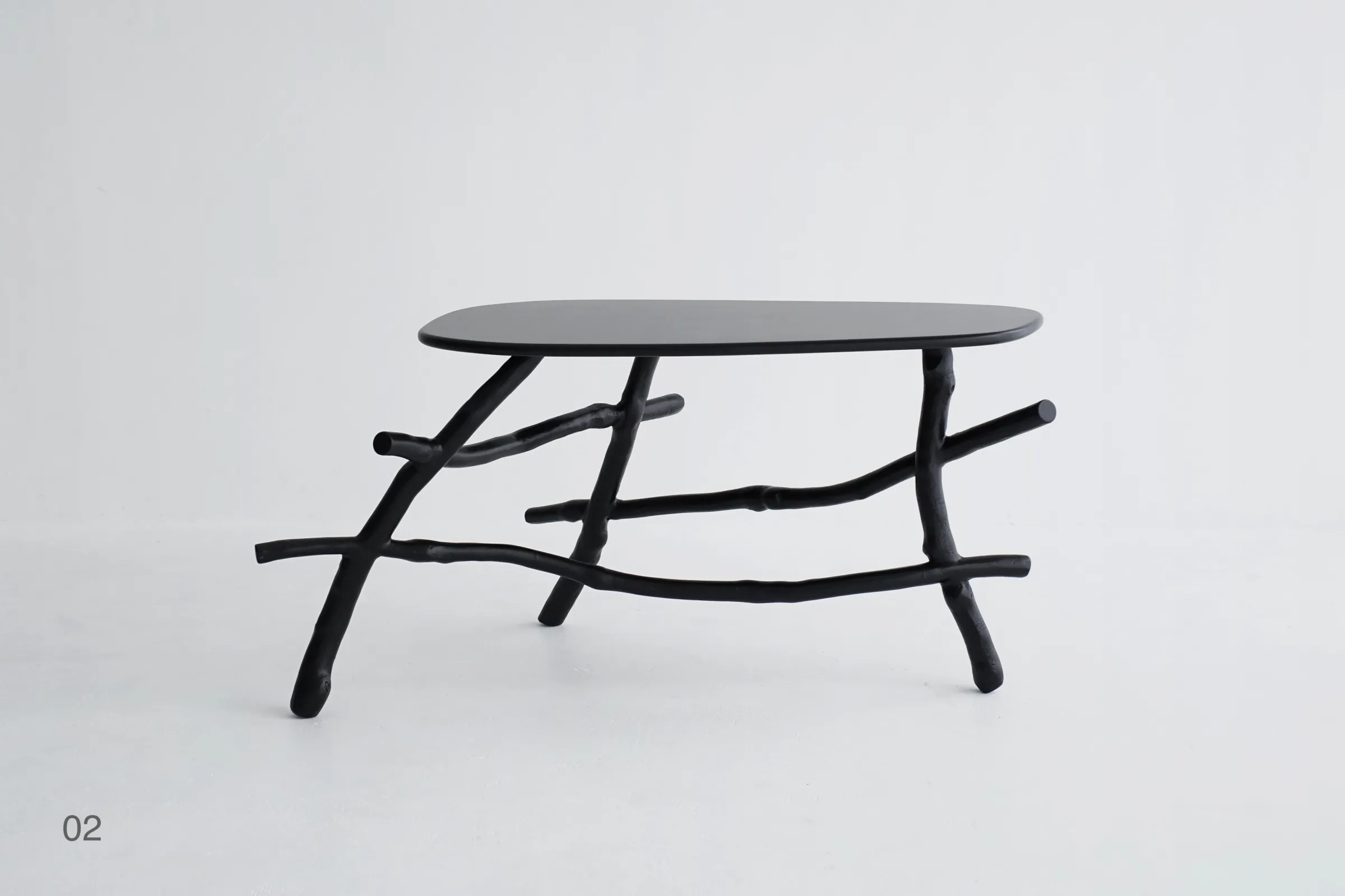 Uneri 02 oval low table assembled from pruned Tokyo street tree branches sustainable furniture design Tokyo